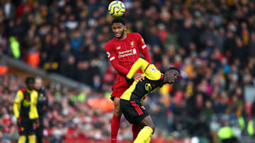 LIVERPOOL, ENGLAND - DECEMBER 14: Joe Gomez of Liverpool challenges for the ball with Ismaila Sarr of Watford during the Premier League match between Liverpool FC and Watford FC at Anfield on December 14, 2019 in Liverpool, United Kingdom. (Photo by Clive Brunskill/Getty Images)