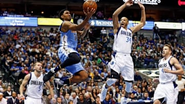 Feb 26, 2016; Dallas, TX, USA; Denver Nuggets guard Gary Harris (14) shoots as Dallas Mavericks guard Devin Harris (34) defends during the game at American Airlines Center. Mandatory Credit: Kevin Jairaj-USA TODAY Sports