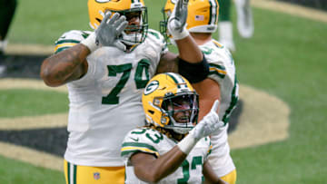 NEW ORLEANS, LOUISIANA - SEPTEMBER 27: Aaron Jones #33 of the Green Bay Packers celebrates his rushing touchdown against the New Orleans Saints with Elgton Jenkins #74 during the second half at Mercedes-Benz Superdome on September 27, 2020 in New Orleans, Louisiana. (Photo by Sean Gardner/Getty Images)