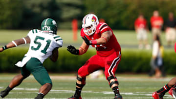 LOUISVILLE, KY - SEPTEMBER 1: Chris Acosta #71 of the Louisville Cardinals blocks against the Ohio Bobcats during the game at Papa John's Cardinal Stadium on September 1, 2013 in Louisville, Kentucky. Louisville won 49-7. (Photo by Joe Robbins/Getty Images)