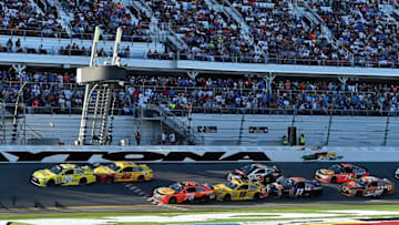 Feb 21, 2016; Daytona Beach, FL, USA; NASCAR Sprint Cup Series driver Matt Kenseth (20) and Joey Logano (22) restart ahead of NASCAR Sprint Cup Series driver Martin Truex Jr. (78) and Kyle Busch (18) during the Daytona 500 at Daytona International Speedway. Mandatory Credit: Jasen Vinlove-USA TODAY Sports
