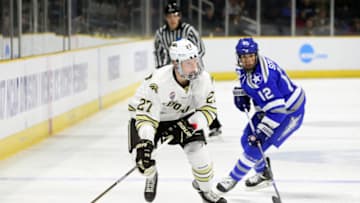 PROVIDENCE, RI - MARCH 24: Western Michigan Broncos forward Wade Allison (27) and Air Force Falcons forward Matt Serratore (12) in action during the first period of the NCAA East Regional first round game between Air Force Falcons and Western Michigan Broncos on March 24, 2017, at the Dunkin Donuts Center in Providence, RI. Air Force defeated Western Michigan Force 5-4. (Photo by M. Anthony Nesmith/Icon Sportswire via Getty Images)