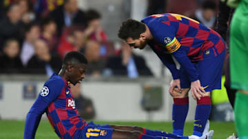BARCELONA, SPAIN - NOVEMBER 27: Ousmane Dembele of FC Barcelona lies injured during the UEFA Champions League group F match between FC Barcelona and Borussia Dortmund at Camp Nou on November 27, 2019 in Barcelona, Spain. (Photo by Etsuo Hara/Getty Images)