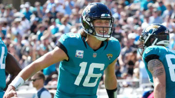 JACKSONVILLE, FLORIDA - OCTOBER 10: Trevor Lawrence #16 of the Jacksonville Jaguars celebrates a one-yard touchdown pass to Jacob Hollister #86 during the second quarter against the Tennessee Titans at TIAA Bank Field on October 10, 2021 in Jacksonville, Florida. (Photo by Mark Brown/Getty Images)
