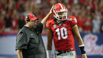 Sep 3, 2016; Atlanta, GA, USA; Georgia Bulldogs offensive cordinator Jim Chaney talks with quarterback Jacob Eason (10) on the sideline during the third quarter of the 2016 Chick-Fil-A Kickoff game against the North Carolina Tar Heels at Georgia Dome. Mandatory Credit: Jason Getz-USA TODAY Sports