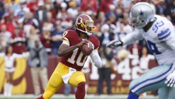 Dec 28, 2014; Landover, MD, USA; Washington Redskins quarterback Robert Griffin III (10) prepares to throw the ball in the first quarter against the Dallas Cowboys at FedEx Field. Mandatory Credit: Geoff Burke-USA TODAY Sports