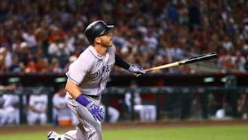 Apr 4, 2016; Phoenix, AZ, USA; Colorado Rockies shortstop Trevor Story hits a three run home run for his first career MLB hit in the third inning against the Arizona Diamondbacks during Opening Day at Chase Field. Mandatory Credit: Mark J. Rebilas-USA TODAY Sports