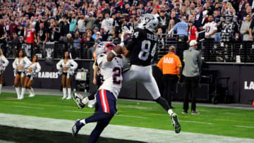 LAS VEGAS, NEVADA - DECEMBER 18: Keelan Cole #84 of the Las Vegas Raiders catches the ball for a touchdown as Marcus Jones #25 of the New England Patriots defends during the fourth quarter at Allegiant Stadium on December 18, 2022 in Las Vegas, Nevada. (Photo by Ethan Miller/Getty Images)