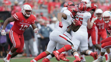 HOUSTON, TX - SEPTEMBER 23: Justin Stockton #4 of the Texas Tech Red Raiders rushes against Ed Oliver #10 and the Houston Cougars defense in the fourth quarter at TDECU Stadium on September 23, 2017 in Houston, Texas. Texas Tech Red Raiders won 27 to 24. (Photo by Thomas B. Shea/Getty Images)