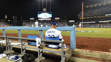LOS ANGELES, CALIFORNIA - OCTOBER 09: Manager Dave Roberts of the Los Angeles Dodgers sits in the dug out during game five of the National League Division Series against the Washington Nationals at Dodger Stadium on October 09, 2019 in Los Angeles, California. The Nationals defeated the Dodgers 7-3 and clinch the series 3-2. (Photo by Harry How/Getty Images)