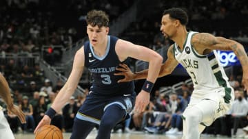 Oct 1, 2022; Milwaukee, Wisconsin, USA; Memphis Grizzlies forward Jake LaRavia (3) drives against Milwaukee Bucks guard George Hill (3) in the first half at Fiserv Forum. Mandatory Credit: Michael McLoone-USA TODAY Sports