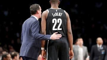 NEW YORK, NY - MARCH 25: Kenny Atkinson of the Brooklyn Nets has a conversation with Caris LeVert