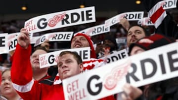 Oct 31, 2014; Detroit, MI, USA; Fans hold up signs for former Detroit Red Wing player Gordie Howe in the first period of the game between the Detroit Red Wings and the Los Angeles Kings at Joe Louis Arena. Mandatory Credit: Rick Osentoski-USA TODAY Sports