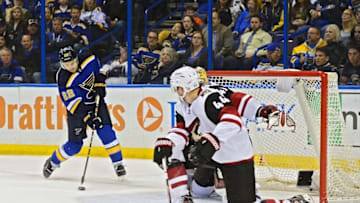 Apr 4, 2016; St. Louis, MO, USA; St. Louis Blues defenseman Kevin Shattenkirk (22) shoots as Arizona Coyotes goalie Mike Smith (41) and defenseman Kevin Connauton (44) defend the net during the second period at Scottrade Center. Mandatory Credit: Jeff Curry-USA TODAY Sports
