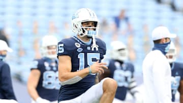 CHAPEL HILL, NC - OCTOBER 10: Beau Corrales #15 of North Carolina stretches before a game between Virginia Tech and North Carolina at Kenan Memorial Stadium on October 10, 2020 in Chapel Hill, North Carolina. (Photo by Andy Mead/ISI Photos/Getty Images)
