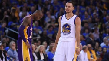 November 1, 2014; Oakland, CA, USA; Golden State Warriors guard Stephen Curry (30) smiles in front of Los Angeles Lakers guard Kobe Bryant (24) during the second quarter at Oracle Arena. Mandatory Credit: Kyle Terada-USA TODAY Sports