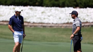 FORT WORTH, TEXAS - JUNE 10: Rory McIlroy of Northern Ireland speaks to Sergio Garcia of Spain during a practice round prior to the Charles Schwab Challenge at Colonial Country Club on June 10, 2020 in Fort Worth, Texas. (Photo by Tom Pennington/Getty Images)