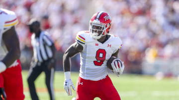 Sep 4, 2021; College Park, Maryland, USA; Maryland Terrapins tight end Chigoziem Okonkwo (9) catches a pass and runs for a touchdown during the first quarter against the West Virginia Mountaineers at Capital One Field at Maryland Stadium. Mandatory Credit: Ben Queen-USA TODAY Sports
