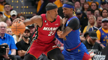 Jun 1, 2023; Denver, CO, USA; Miami Heat forward Jimmy Butler (22) dribbles the ball against Denver Nuggets guard Kentavious Caldwell-Pope (5) during the third quarter in game one of the 2023 NBA Finals at Ball Arena. Mandatory Credit: Kyle Terada-USA TODAY Sports