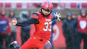Nov 22, 2014; Salt Lake City, UT, USA; Utah Utes punter Tom Hackett (33) punts the ball during the second half against the Arizona Wildcats at Rice-Eccles Stadium. Arizona won 42-10. Mandatory Credit: Russ Isabella-USA TODAY Sports