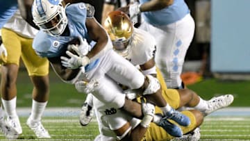 CHAPEL HILL, NORTH CAROLINA - NOVEMBER 27: Michael Carter #8 of the North Carolina Tar Heels runs against the Notre Dame Fighting Irish during the second half of their game at Kenan Stadium on November 27, 2020 in Chapel Hill, North Carolina. Notre Dame won 31-17. (Photo by Grant Halverson/Getty Images)