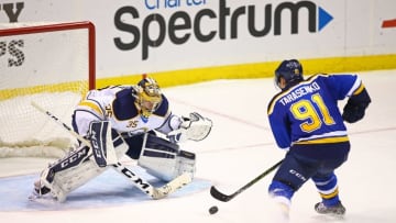 Nov 19, 2015; St. Louis, MO, USA; St. Louis Blues right wing Vladimir Tarasenko (91) skates in with the puck against Buffalo Sabres goalie Linus Ullmark (35) during a game at Scottrade Center. The Blues won the game 3-2 in a shootout. Mandatory Credit: Billy Hurst-USA TODAY Sports