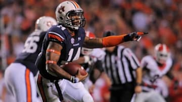 Nov 16, 2013; Auburn, AL, USA; Auburn Tigers quarterback Nick Marshall (14) runs the ball during the second half against the Georgia Bulldogs at Jordan Hare Stadium. The Tigers defeated the Bulldogs 43-38. Mandatory Credit: Shanna Lockwood-USA TODAY Sports