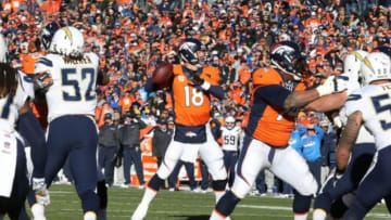 Jan 12, 2014; Denver, CO, USA; Denver Broncos quarterback Peyton Manning (18) throws a first quarter touchdown against the San Diego Chargers during the 2013 AFC divisional playoff football game at Sports Authority Field at Mile High. Mandatory Credit: Matthew Emmons-USA TODAY Sports
