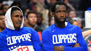LOS ANGELES, CA - OCTOBER 13: Los Angeles Clippers Guard Lou Williams (23) and Los Angeles Clippers Guard Patrick Beverley (21) looks on from the bench during a NBA preseason game between the Melbourne United and the Los Angeles Clippers on October 13, 2019 at STAPLES Center in Los Angeles, CA. (Photo by Brian Rothmuller/Icon Sportswire via Getty Images)
