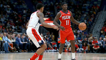 NEW ORLEANS, LOUISIANA - NOVEMBER 28: Jrue Holiday #11 of the New Orleans Pelicans is defended by Bradley Beal #3 of the Washington Wizards (Photo by Sean Gardner/Getty Images)