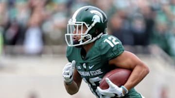 Oct 29, 2016; East Lansing, MI, USA; Michigan State Spartans wide receiver R.J. Shelton (12) runs the ball during the first half of a game against the Michigan Wolverines at Spartan Stadium. Mandatory Credit: Mike Carter-USA TODAY Sports