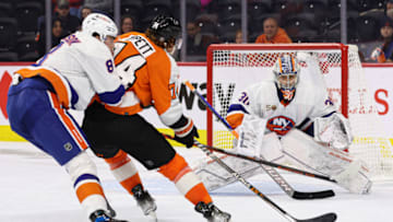 Oct 4, 2022; Philadelphia, Pennsylvania, USA; Philadelphia Flyers right wing Owen Tippett (74) breaks in past New York Islanders defenseman Noah Dobson (8) for a shot on goaltender Ilya Sorokin (30) during the overtime period at Wells Fargo Center. Mandatory Credit: Bill Streicher-USA TODAY Sports