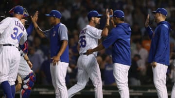 Chicago Cubs starting pitcher Cole Hamels (35) and teammates celebrate a 7-1- win against the Cincinnati Reds at Wrigley Field in Chicago on Thursday, Aug. 23, 2018. (John J. Kim/Chicago Tribune/TNS via Getty Images)