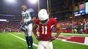 Oct 23, 2016; Glendale, AZ, USA; Arizona Cardinals wide receiver Larry Fitzgerald (11) and Seattle Seahawks linebacker K.J. Wright (50) react following the game at University of Phoenix Stadium. The game ended in a 6-6 tie after overtime. Mandatory Credit: Mark J. Rebilas-USA TODAY Sports