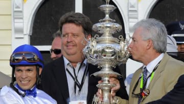 Jockey Jesus Lopez Castanon, from left, trainer Dale L. Romans and owner Michael Lauffer celebrate with the Woodlawn Vase after Shackleford won the 136th Preakness Stakes at Pimlico Race Course in Baltimore, Maryland, Saturday, May 21, 2011. (Lloyd Fox/Baltimore Sun/MCT via Getty Images)