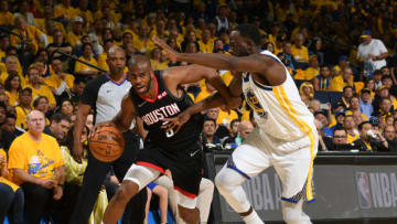 OAKLAND, CA - APRIL 28: Chris Paul #3 of the Houston Rockets handles the ball against the Golden State Warriors during Game One of the Western Conference Semi-Finals of the 2019 NBA Playoffs on April 28, 2019 at ORACLE Arena in Oakland, California. NOTE TO USER: User expressly acknowledges and agrees that, by downloading and or using this photograph, User is consenting to the terms and conditions of the Getty Images License Agreement. Mandatory Copyright Notice: Copyright 2019 NBAE (Photo by Noah Graham/NBAE via Getty Images)