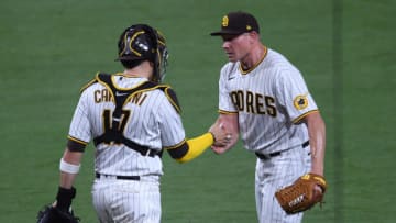 Apr 30, 2021; San Diego, California, USA; San Diego Padres relief pitcher Mark Melancon (R) and catcher Victor Caratini (17) celebrate on the field after defeating the San Francisco Giants at Petco Park. Mandatory Credit: Orlando Ramirez-USA TODAY Sports