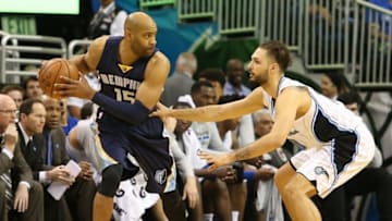 Apr 3, 2016; Orlando, FL, USA; Memphis Grizzlies guard Vince Carter (15) looks to pass as Orlando Magic guard Evan Fournier (10) defends in the third quarter at Amway Center. The Orlando Magic won 119-107. Mandatory Credit: Logan Bowles-USA TODAY Sports