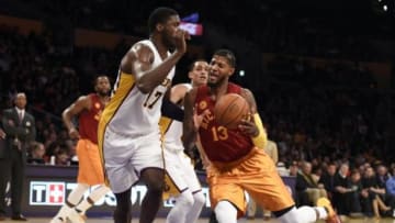 Nov 29, 2015; Los Angeles, CA, USA; Indiana Pacers forward Paul George (13) drives against Los Angeles Lakers center Roy Hibbert (17) in the first half at Staples Center. Mandatory Credit: Richard Mackson-USA TODAY Sports