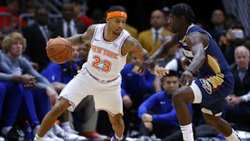 NEW ORLEANS, LOUISIANA - NOVEMBER 16: Trey Burke #23 of the New York Knicks drives against Jrue Holiday #11 of the New Orleans Pelicans during the first half at the Smoothie King Center on November 16, 2018 in New Orleans, Louisiana. NOTE TO USER: User expressly acknowledges and agrees that, by downloading and or using this photograph, User is consenting to the terms and conditions of the Getty Images License Agreement. (Photo by Jonathan Bachman/Getty Images)