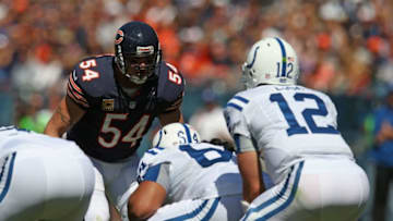 CHICAGO, IL - SEPTEMBER 09: Brian Urlacher #54 of the Chicago Bears looks at Andrew Luck #12 of the Indianapolis Colts before the snap during their 2012 NFL season opener at Soldier Field on September 9, 2012 in Chicago, Illinois. The Bears defeated the Colts 41-21. (Photo by Jonathan Daniel/Getty Images)