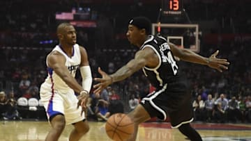 Nov 14, 2016; Los Angeles, CA, USA; Los Angeles Clippers guard Chris Paul (3) passes the ball around Brooklyn Nets forward Rondae Hollis-Jefferson (24) in the first half of a NBA basketball game at Staples Center. Mandatory Credit: Richard Mackson-USA TODAY Sports