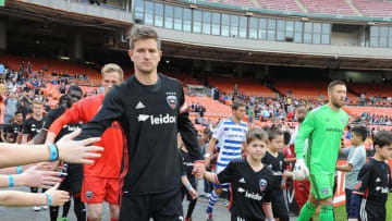 Mar 26, 2016; Washington, DC, USA; D.C. United defender Bobby Boswell (32) is escorted onto the field against FC Dallas before the game at Robert F. Kennedy Memorial. Mandatory Credit: Brad Mills-USA TODAY Sports