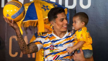 Mexican football club Tigres' new Mexican defender Carlos Salcedo holds his son during his presentation at the Estadio Universitario, in Monterrey, Mexico, On January 22, 2019. - Salcedo joins Tigres from Eintracht Frankfurt. (Photo by Julio Cesar AGUILAR / AFP) (Photo credit should read JULIO CESAR AGUILAR/AFP/Getty Images)