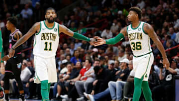 MIAMI, FL - JANUARY 10: Kyrie Irving #11 of the Boston Celtics celebrates with Marcus Smart #36 against the Miami Heat during the second half at American Airlines Arena on January 10, 2019 in Miami, Florida. NOTE TO USER: User expressly acknowledges and agrees that, by downloading and or using this photograph, User is consenting to the terms and conditions of the Getty Images License Agreement. (Photo by Michael Reaves/Getty Images)