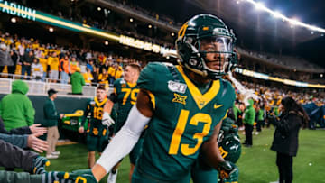 WACO, TX - OCTOBER 31: Wide receiver R.J. Sneed #13 of the Baylor Bearson slaps hands with fans after a victory over West Virginia Mountaineers at McLane Stadium October 31, 2019 in Waco, Texas. (Photo by Adrian Garcia/Getty Images)