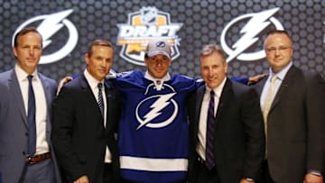 Jun 27, 2014; Philadelphia, PA, USA; Anthony Deangelo poses for a photo with team officials after being selected as the number nineteen overall pick to the Tampa Bay Lightning in the first round of the 2014 NHL Draft at Wells Fargo Center. Mandatory Credit: Bill Streicher-USA TODAY Sports