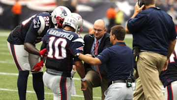Sep 18, 2016; Foxborough, MA, USA; New England Patriots quarterback Jimmy Garoppolo (10) injured after a play against the Miami Dolphins in the first quarter at Gillette Stadium. Mandatory Credit: David Butler II-USA TODAY Sports