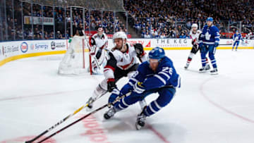 TORONTO, ON - JANUARY 20: Connor Brown #28 of the Toronto Maple Leafs battles with the puck with Niklas Hjalmarsson #4 of the Arizona Coyotes during the third period at the Scotiabank Arena on January 20, 2019 in Toronto, Ontario, Canada. (Photo by Mark Blinch/NHLI via Getty Images)