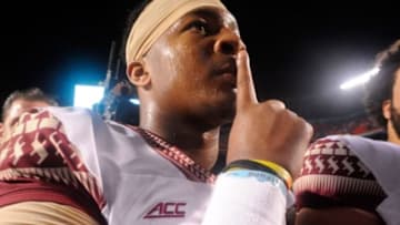 Nov 15, 2014; Miami Gardens, FL, USA; Florida State Seminoles quarterback Jameis Winston (5) gestures to the crowd as the Florida State Seminoles beat the Miami Hurricanes 30-26 at Sun Life Stadium. Mandatory Credit: David Manning-USA TODAY Sports